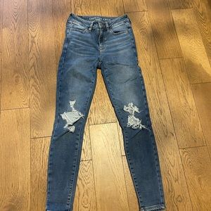 Medium wash skinny jeans with rips